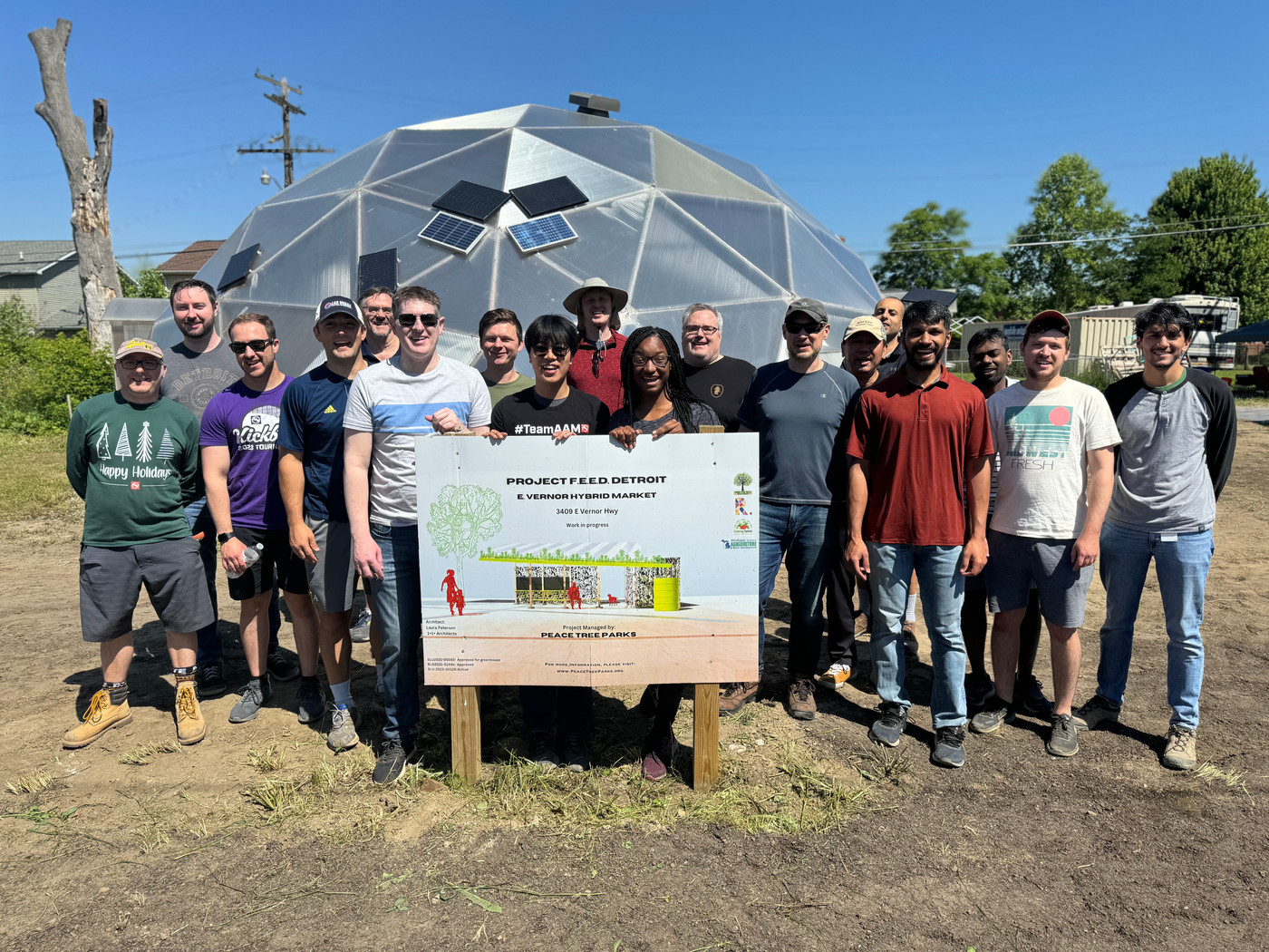 Volunteers and Growing Spaces crew beside the newly raised geodesic grow dome